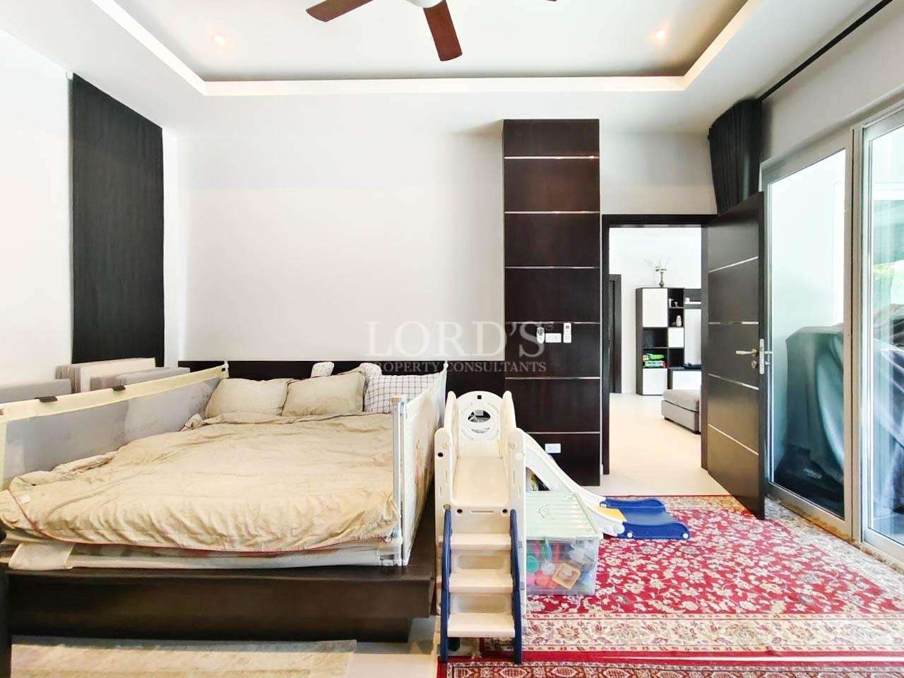 Bedroom with large bed and ceiling fan
