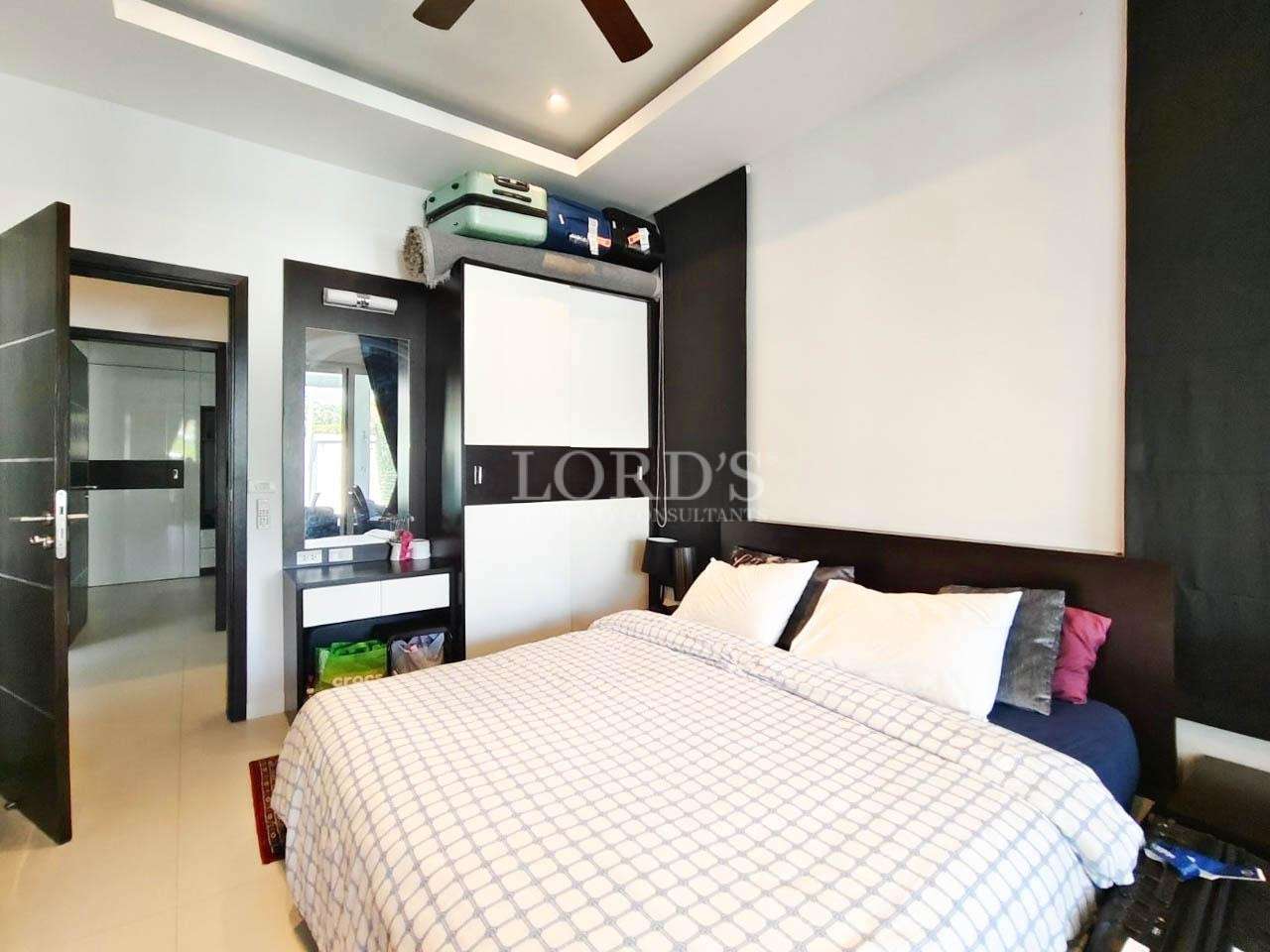 Bedroom with wardrobe and neutral interior