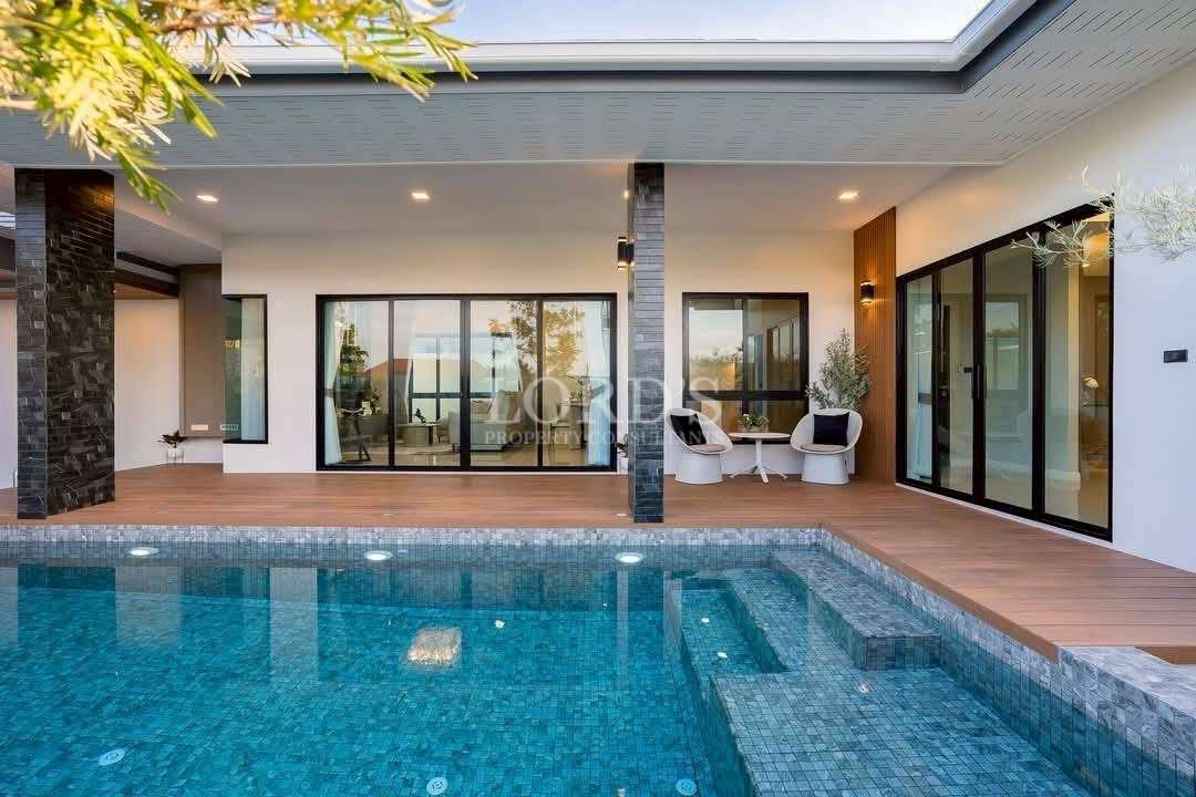 Pool area with covered terrace and seating