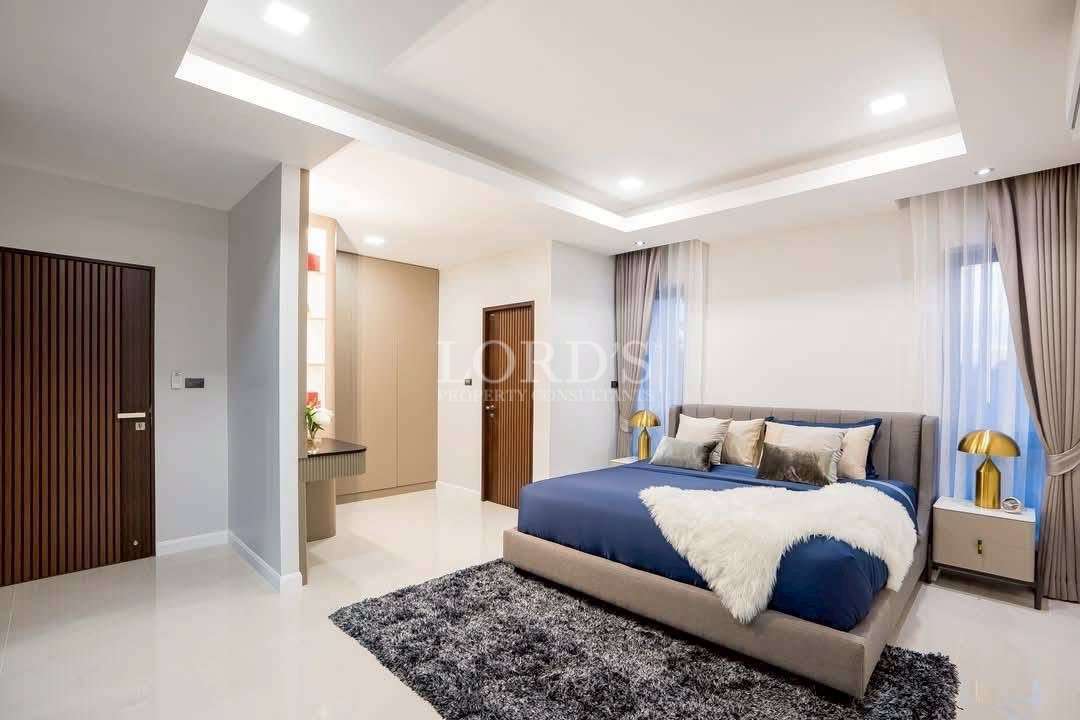 Bedroom with bed and soft lighting