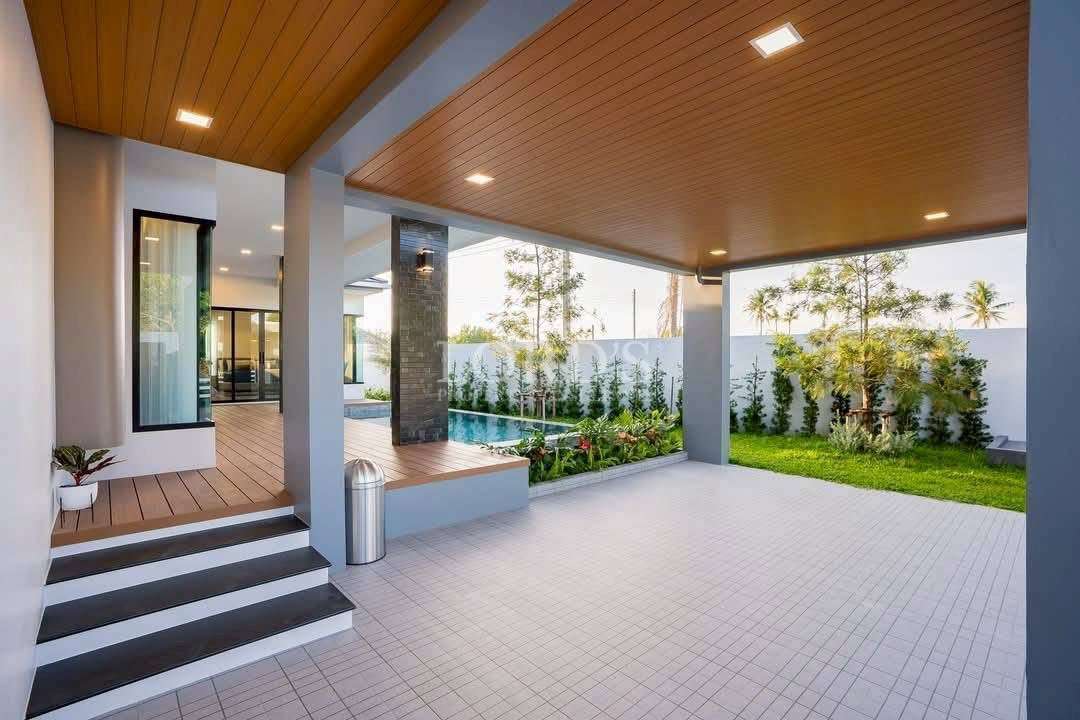 Outdoor terrace with roof and seating area