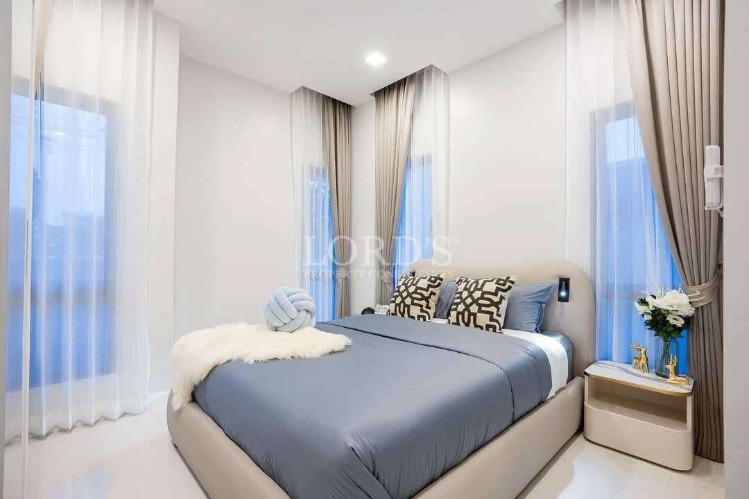 Bedroom with bed and blue bedding