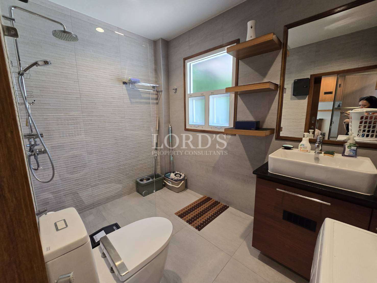 Bathroom with shower and tiled walls