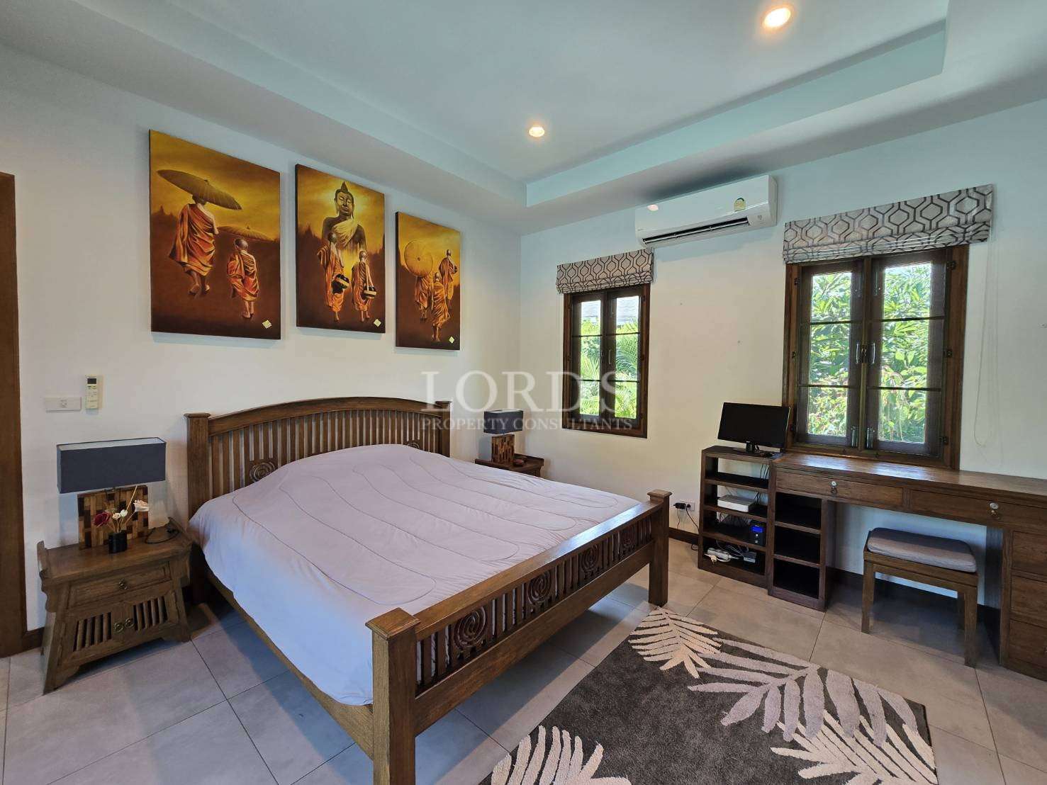 Bedroom with bed and wooden furniture