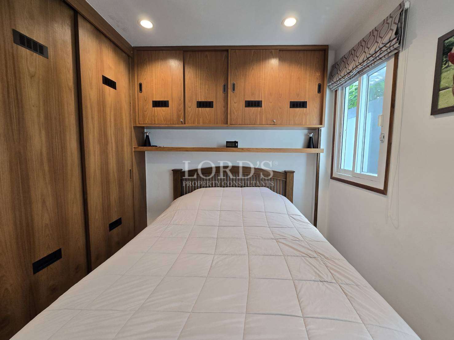 Bedroom with bed and built-in storage