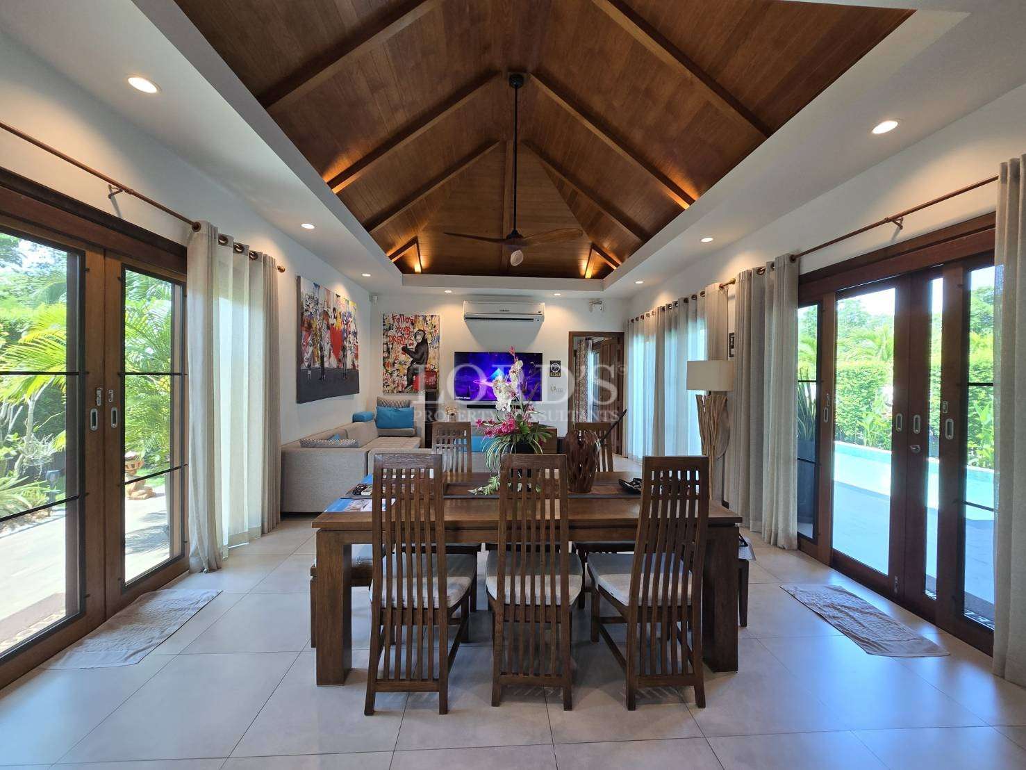 Dining room with wooden ceiling and table
