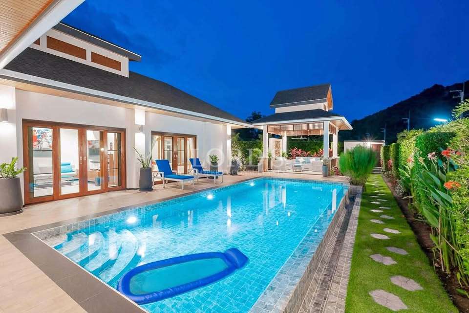 Poolside at night with modern lighting