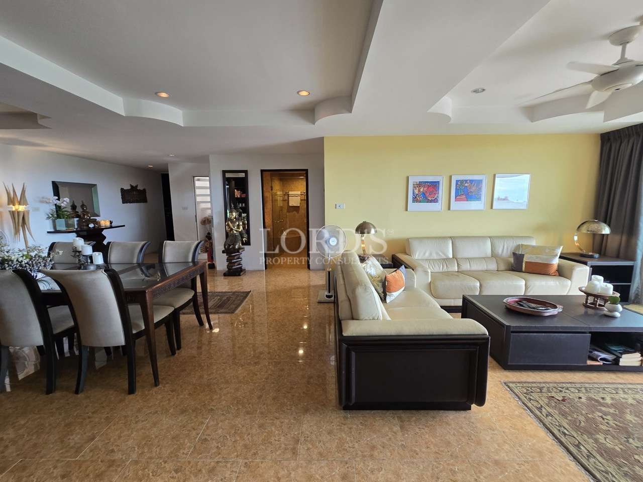 Open-plan living and dining area with modern furnishings.