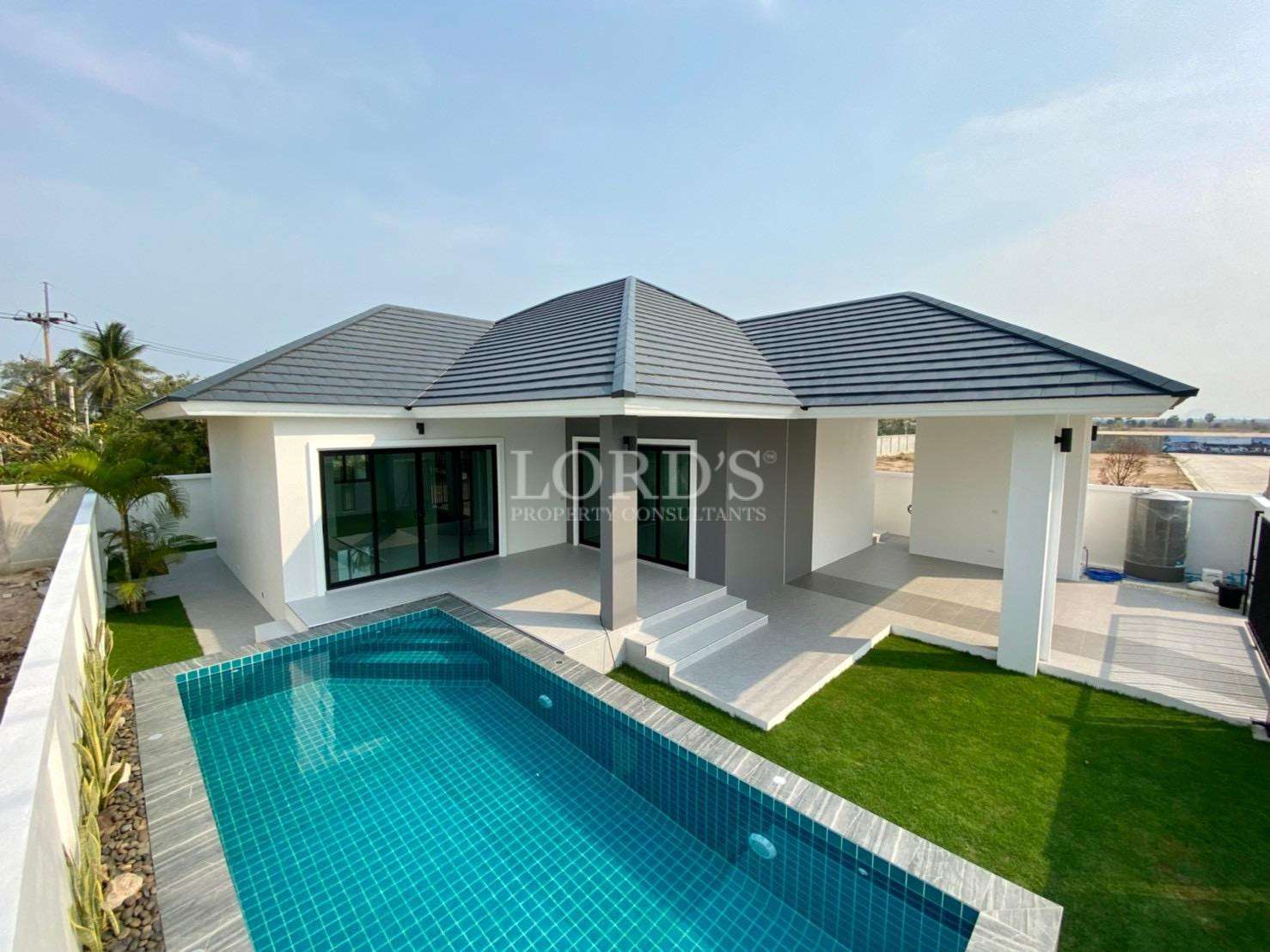 Modern single-storey pool villa with private swimming pool and landscaped garden.
