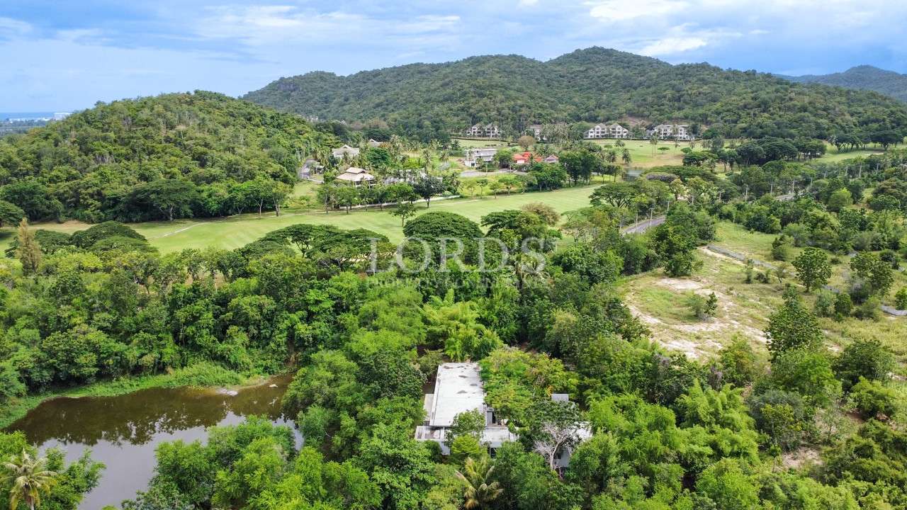 Hillside landscape with trees and property view
