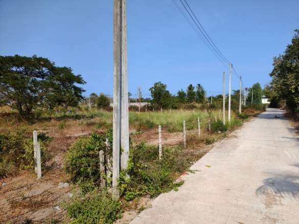 Road with utility poles and land area