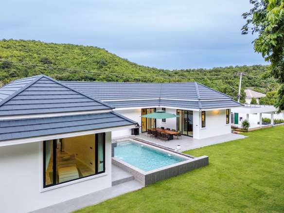 Modern house with pool and greenery