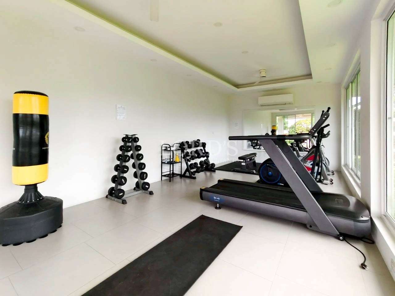 Modern gym with exercise equipment.