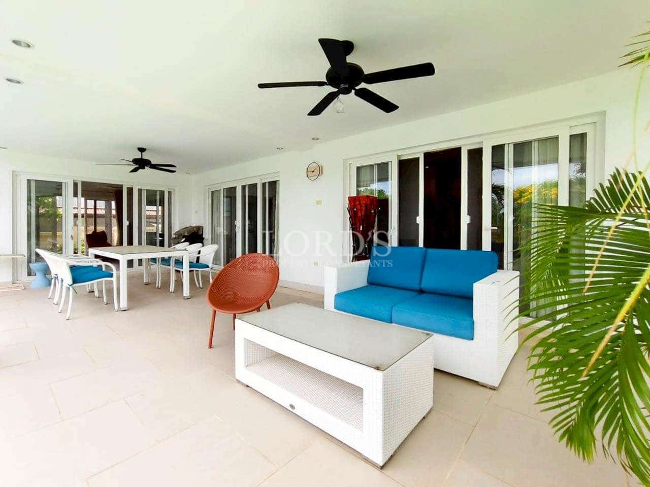 Modern patio with seating and fans
