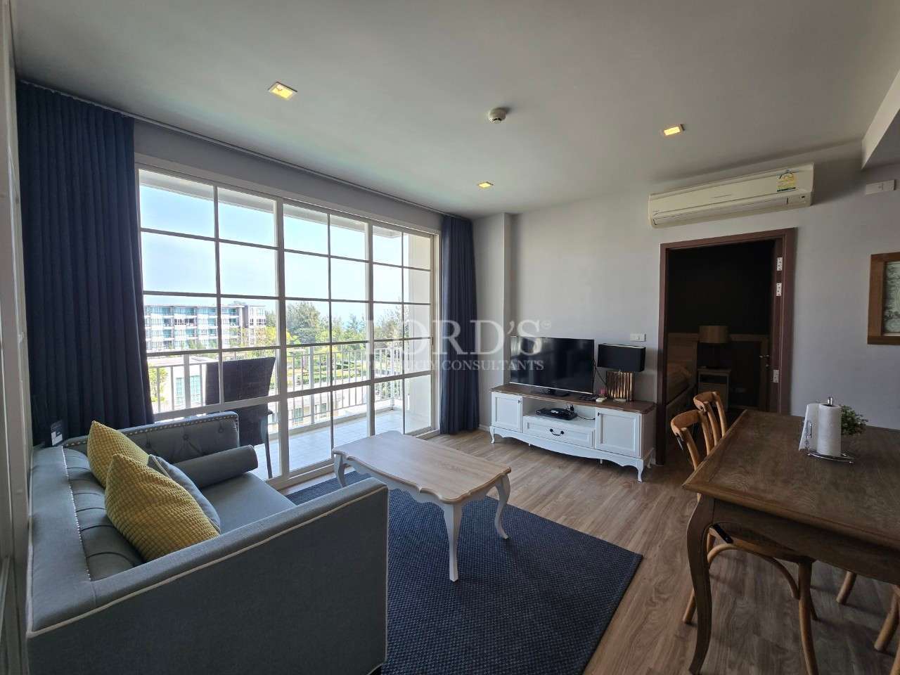 Balcony view overlooking a pool.