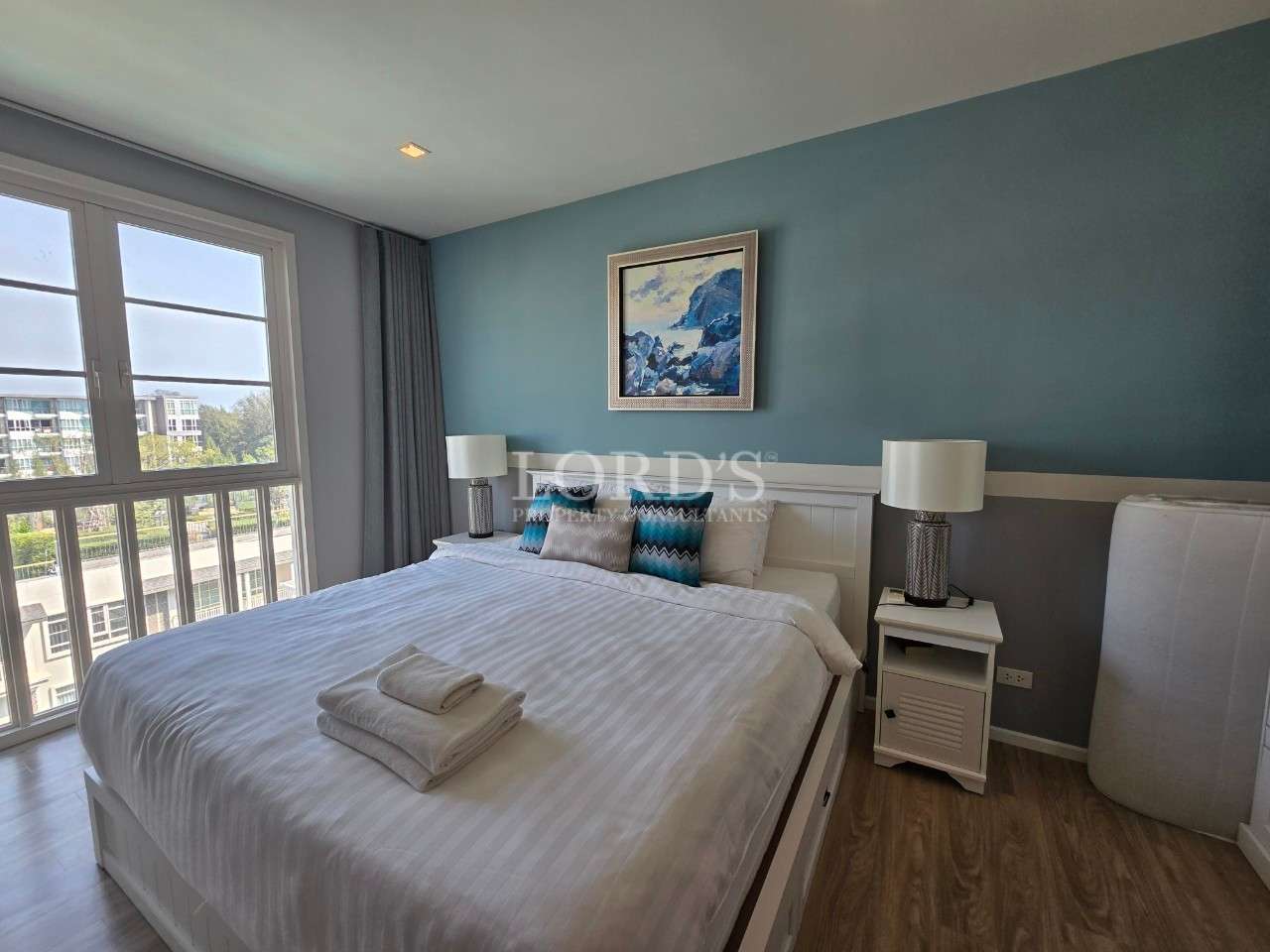 Modern bedroom with blue accent wall