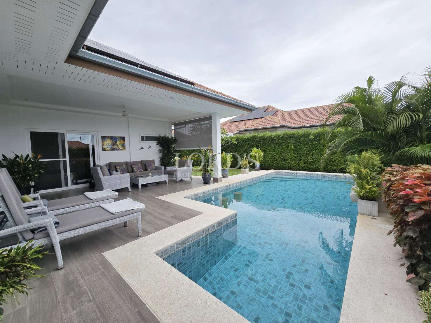 Modern poolside area with lounge chairs