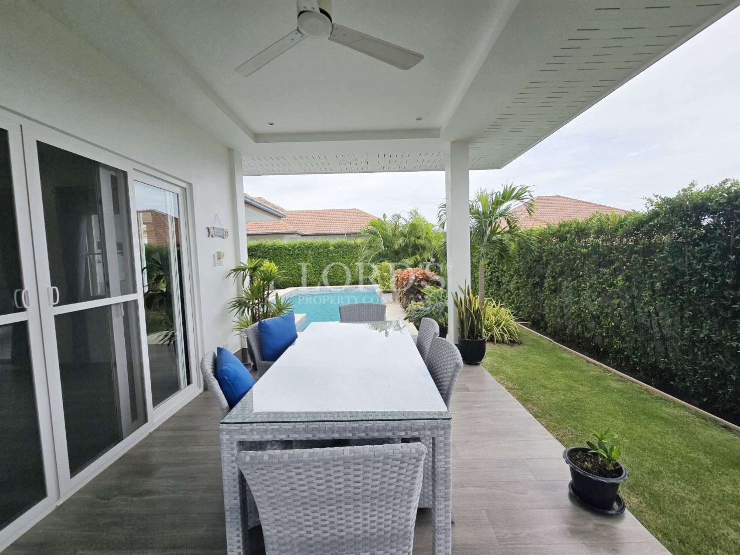 Outdoor dining area with greenery