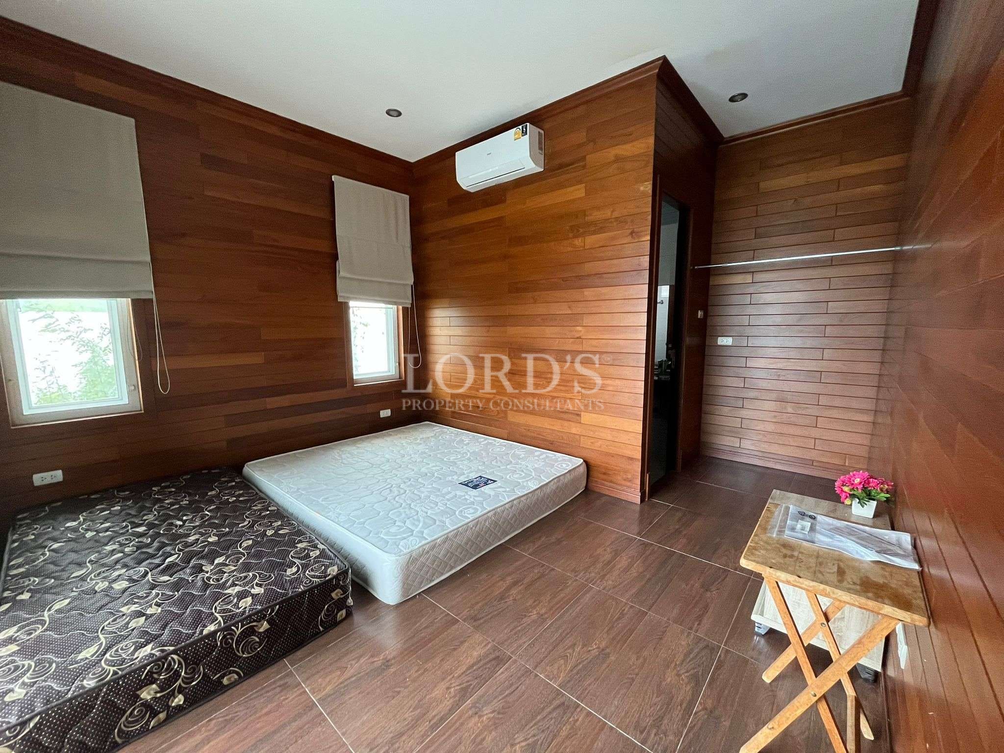 Empty wooden room with mattresses