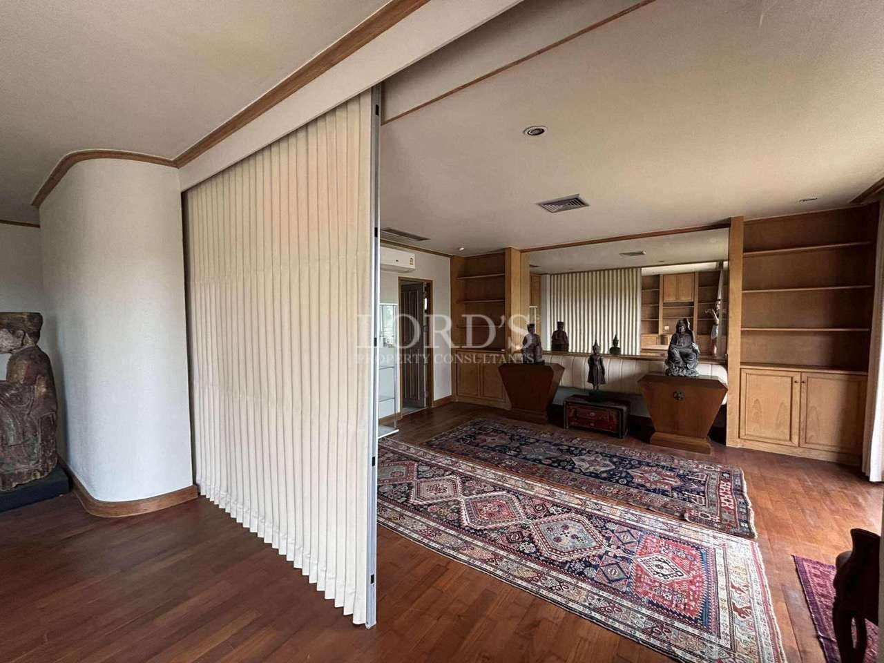 Spacious room with wooden accents.