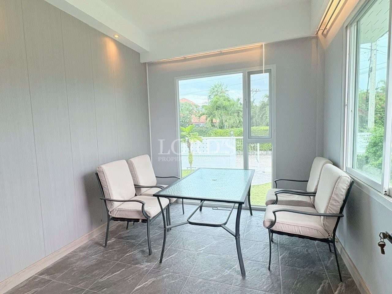 Modern sunroom with seating and table