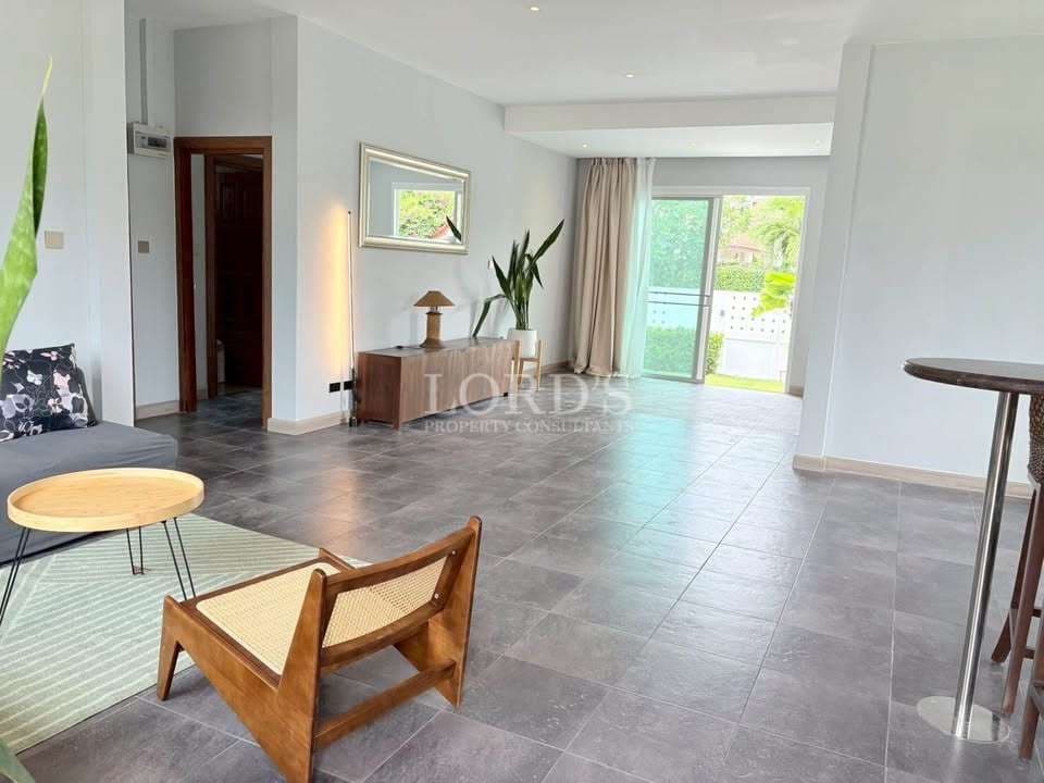 Modern, spacious living area with greenery