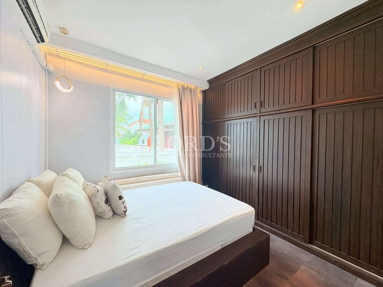 Cozy bedroom with wooden furniture.