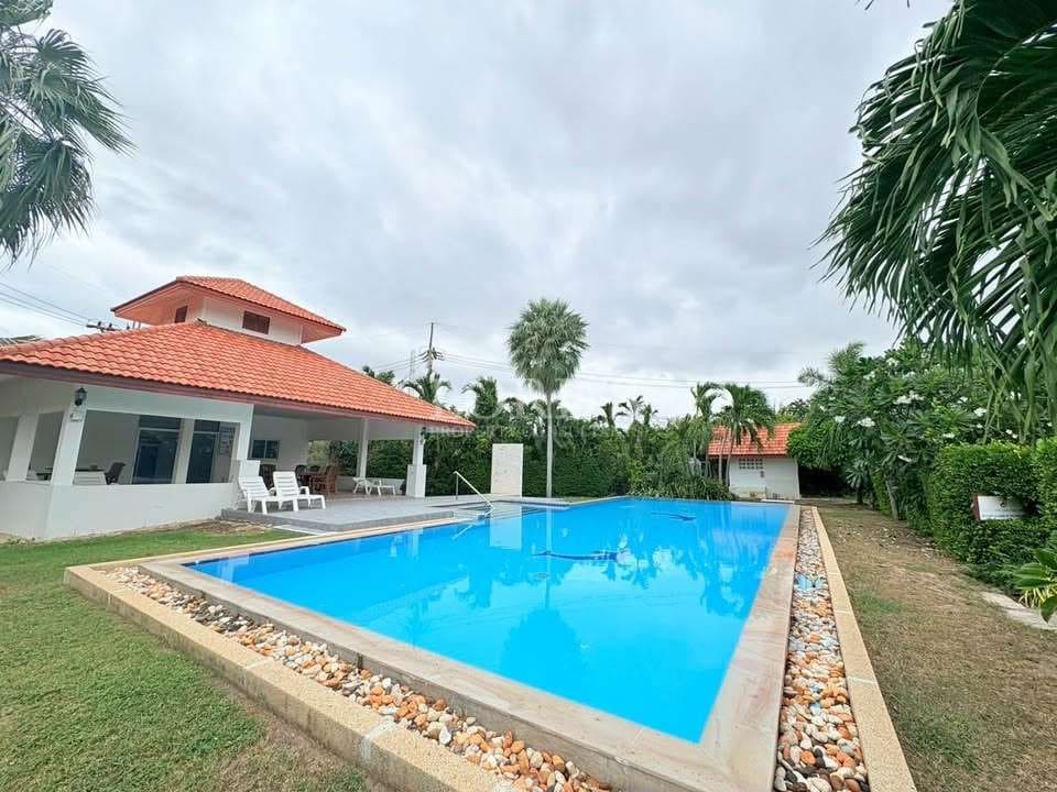 Modern villa with pool and greenery