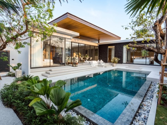 Modern luxury pool villa with private swimming pool, glass walls, wooden roof, and tropical landscaping.