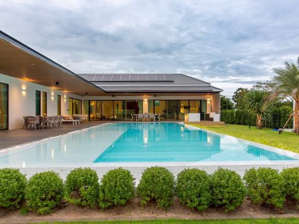Modern villa with pool and greenery