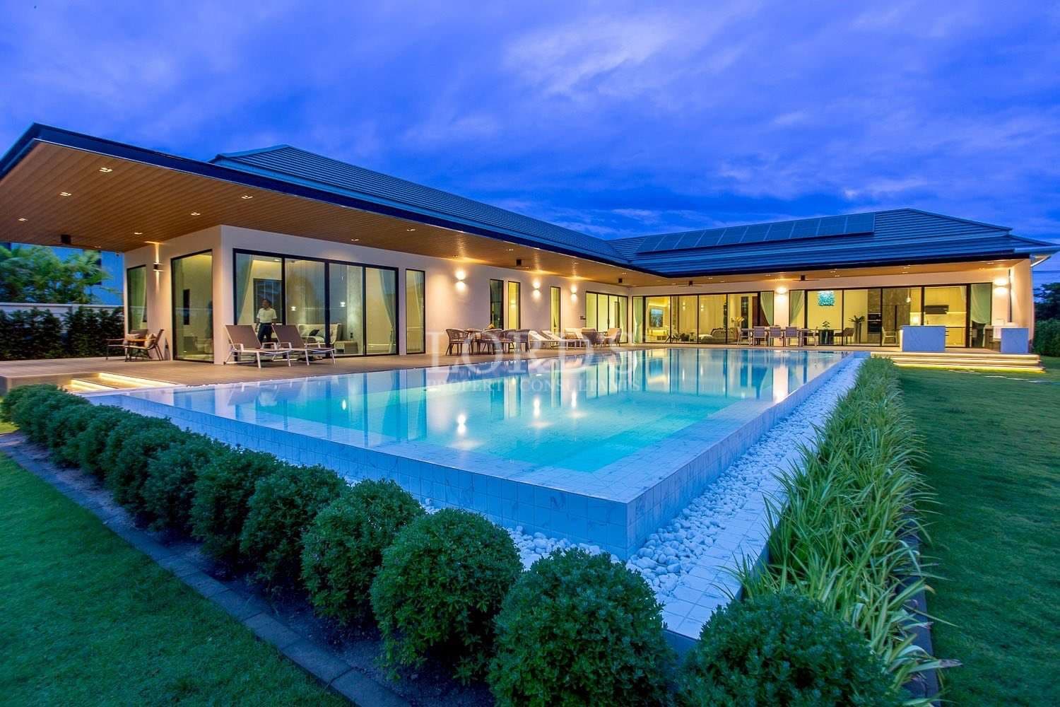 Modern house with pool at dusk