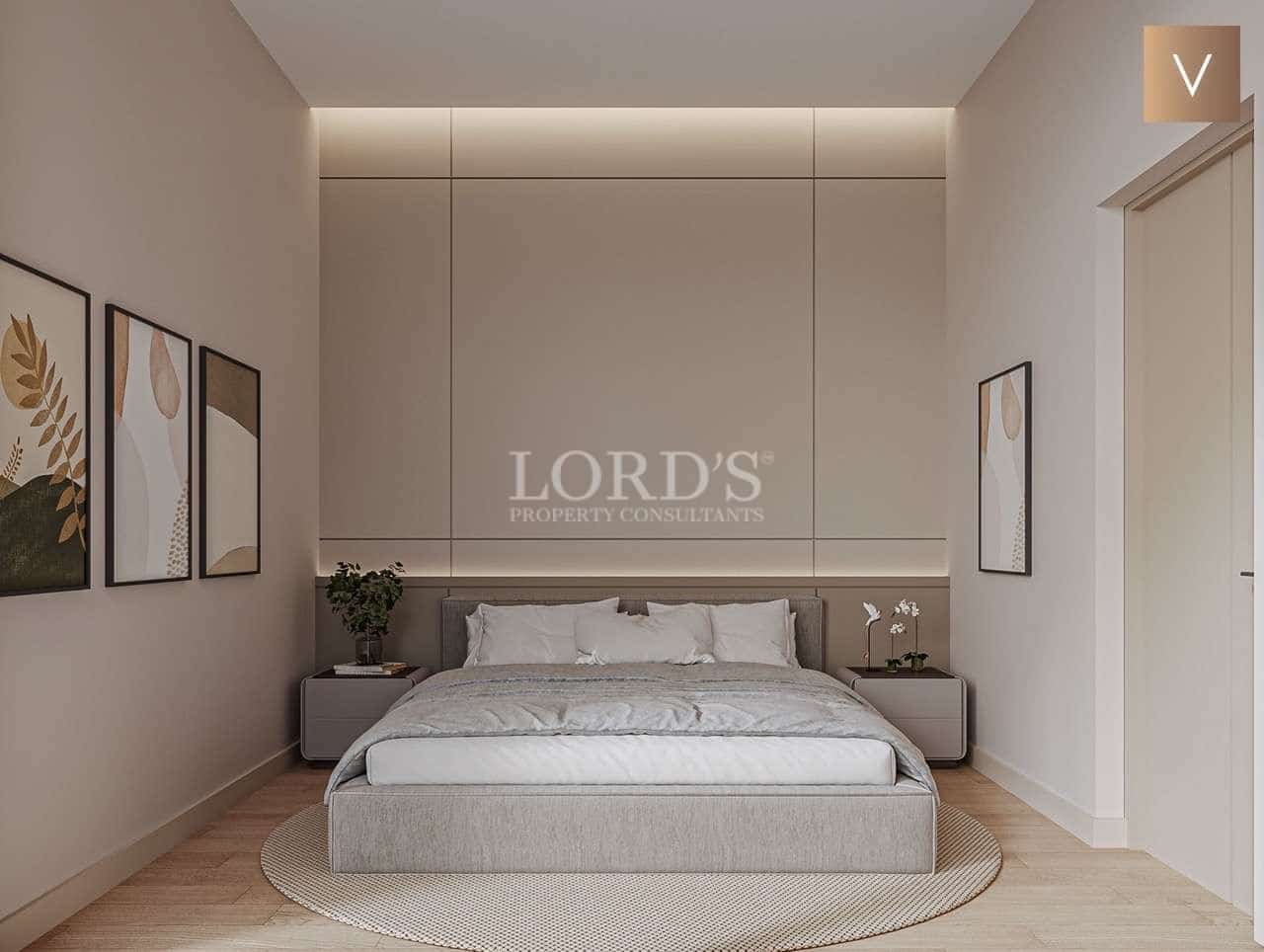 Modern minimalist bedroom with artwork.