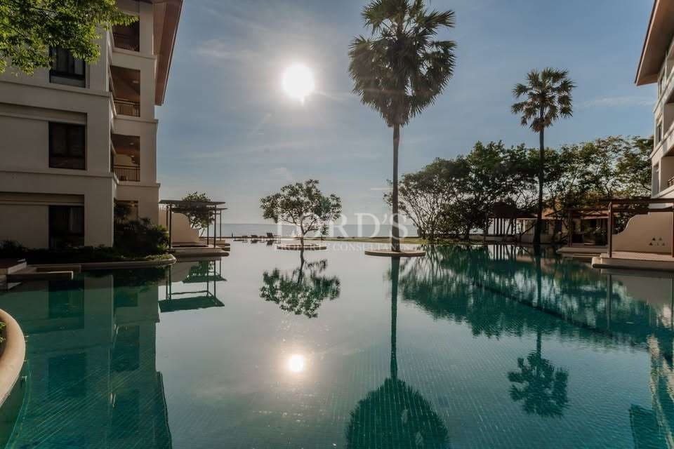 Serene poolside view with palm trees