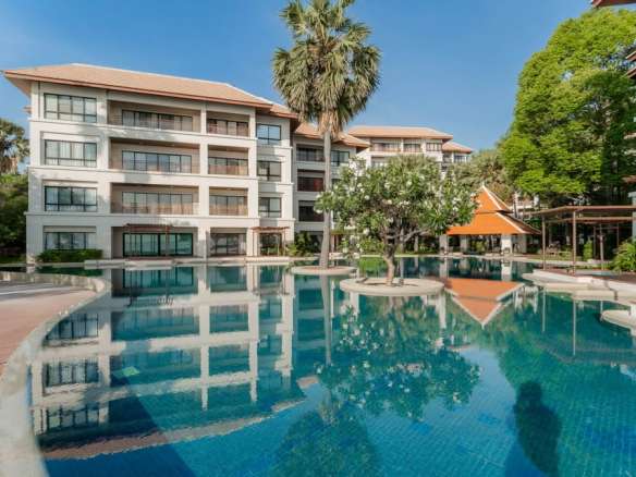 Modern building with pool and greenery