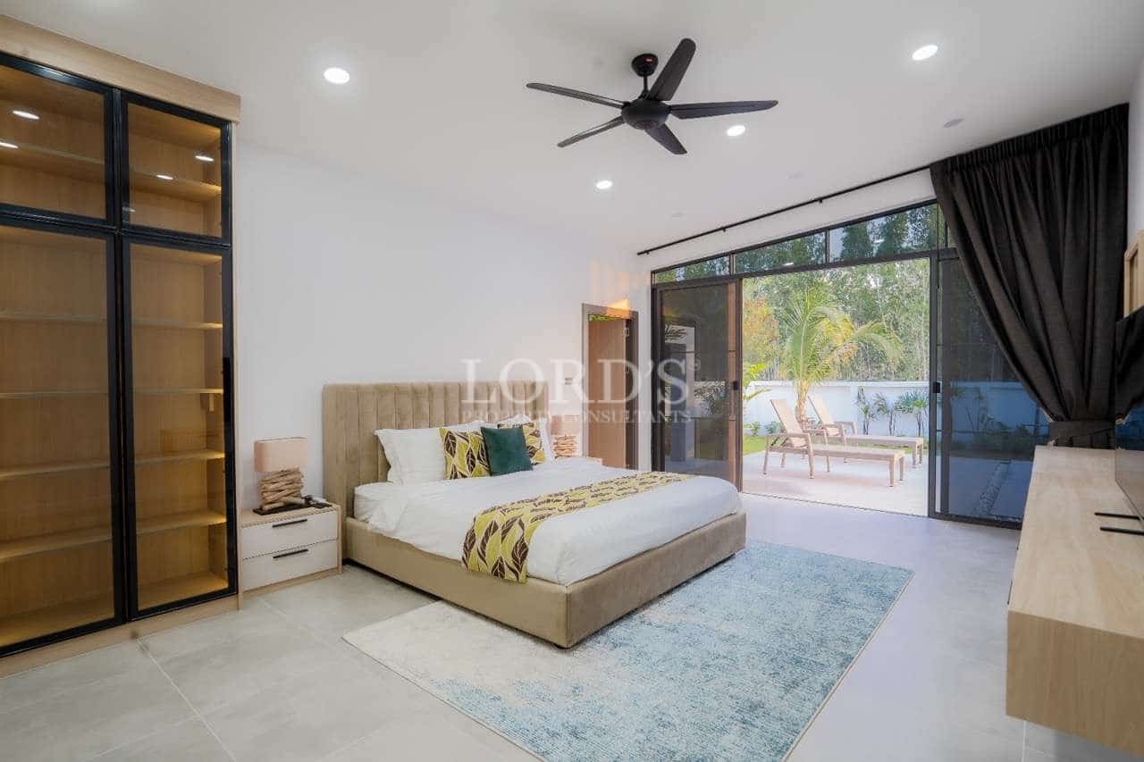 Modern bedroom with large windows