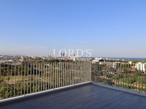 Balcony with railing and city skyline