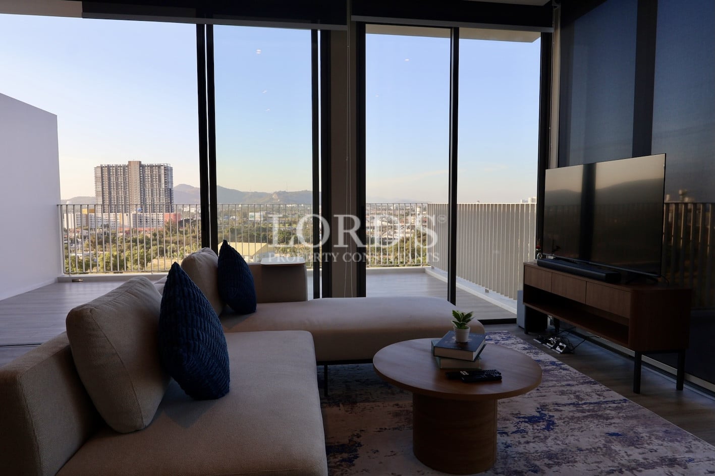 Living room with large window and city view