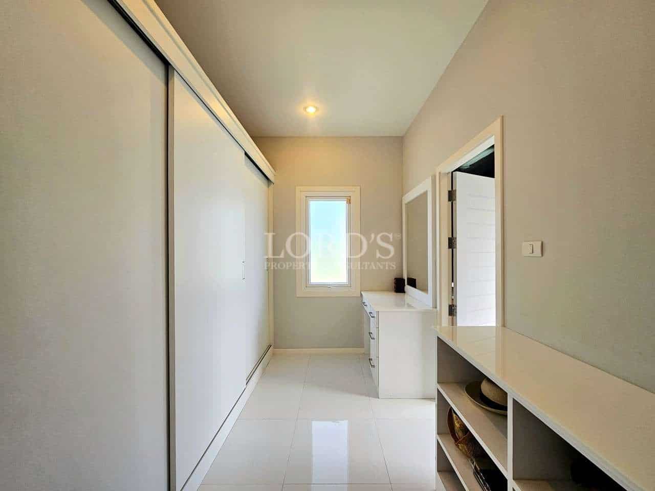 Bright, modern hallway with storage