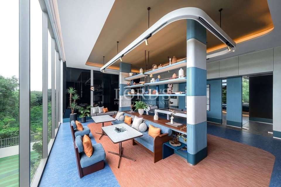 Modern luxury lounge interior with floor-to-ceiling glass windows, designer seating, open shelving, and contemporary ambient lighting.