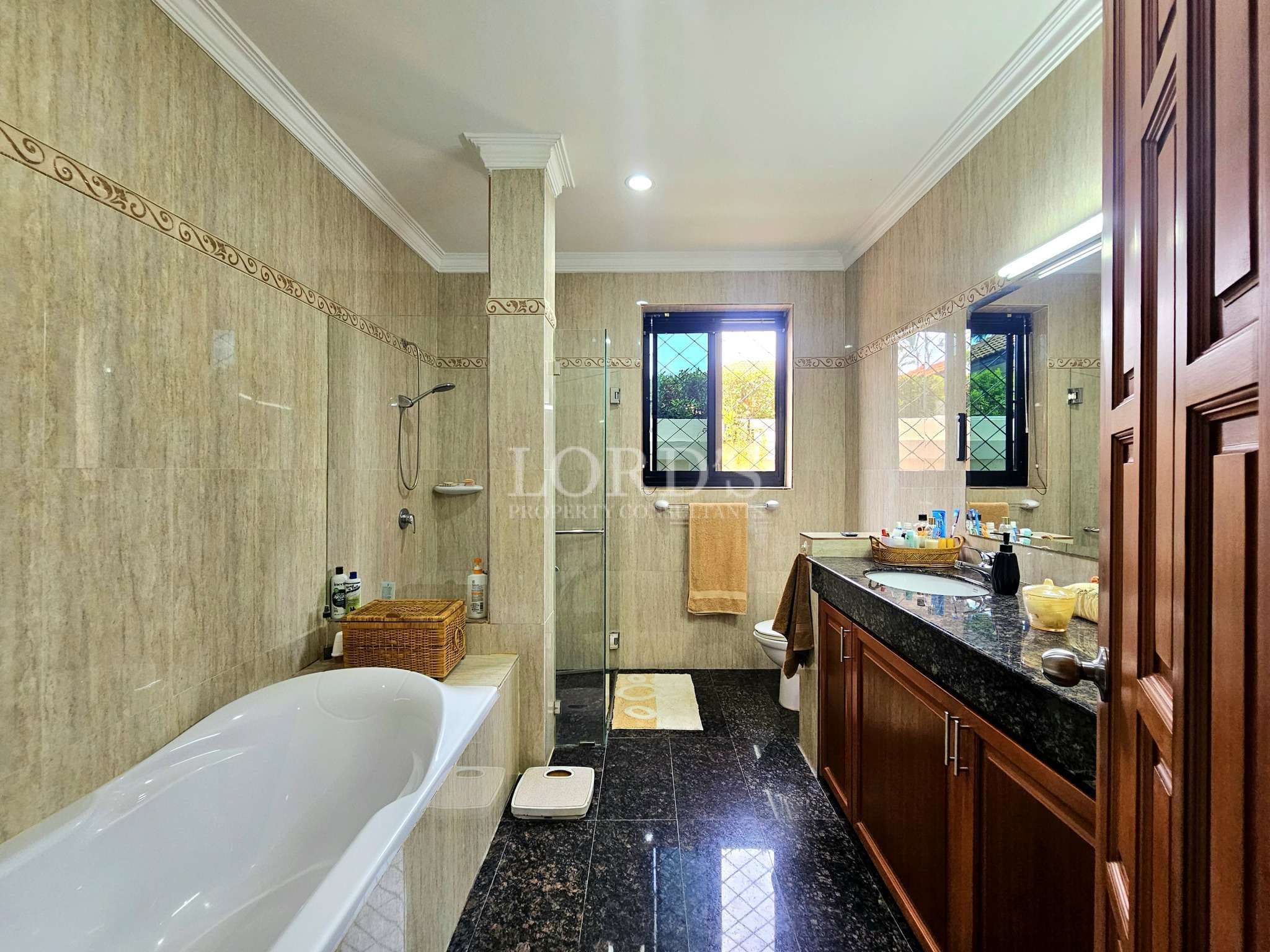 Spacious, modern bathroom with tub