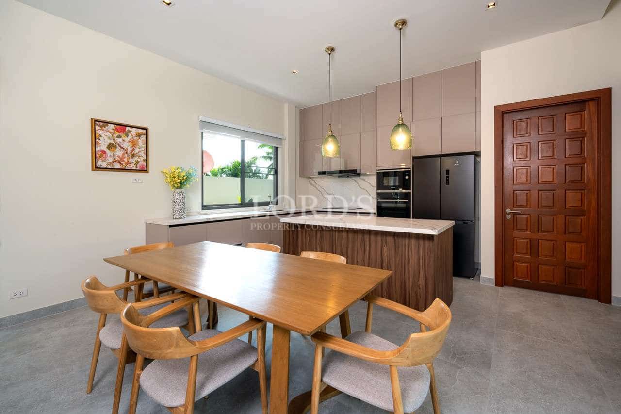Modern kitchen with dining table.