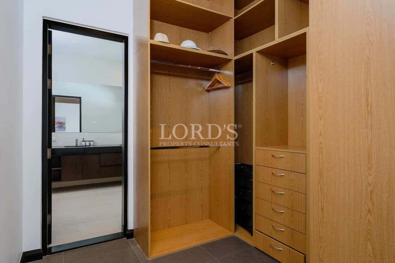 Empty wooden closet with mirror