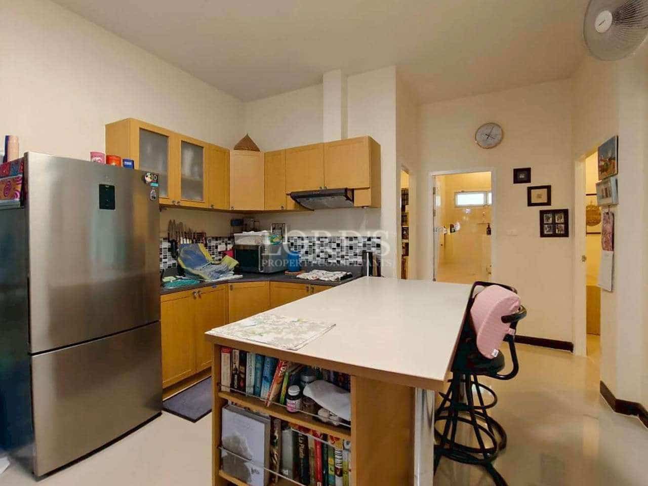 Modern kitchen with wooden cabinets.