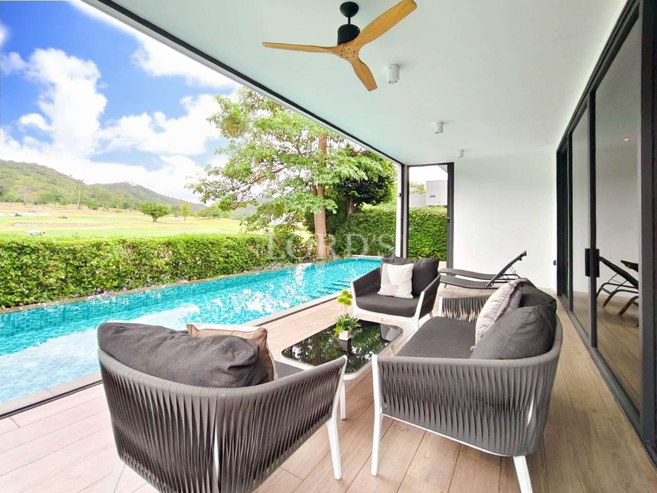Modern patio overlooking a serene pool