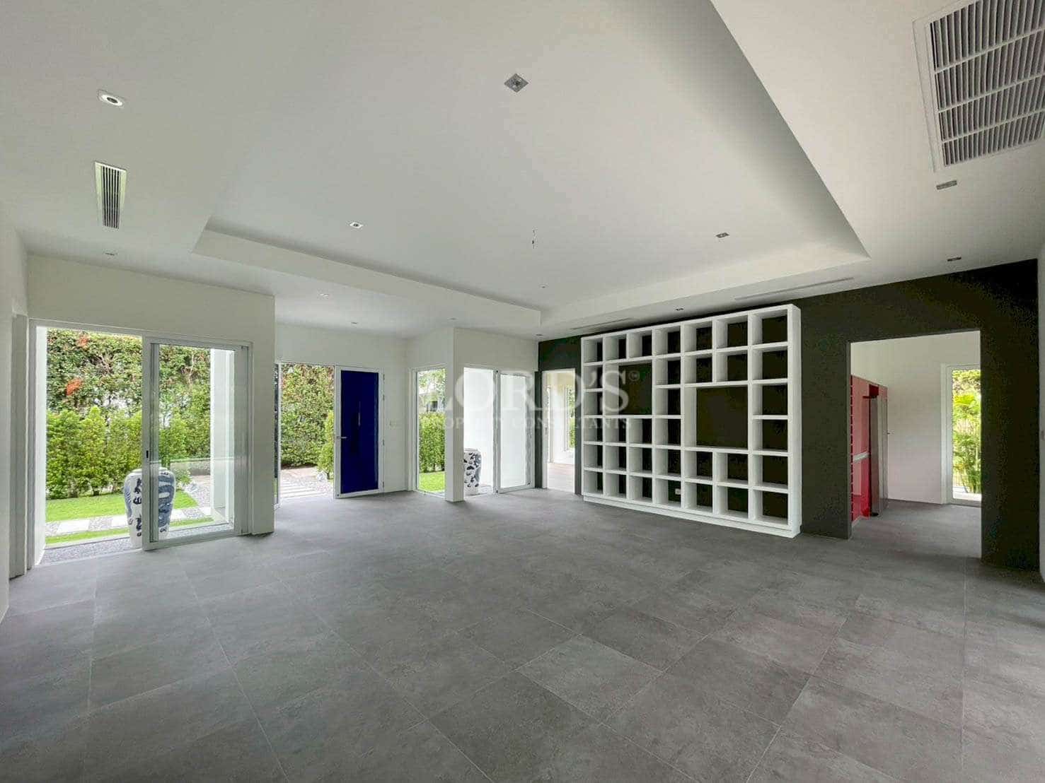 Spacious modern interior with colorful doors.