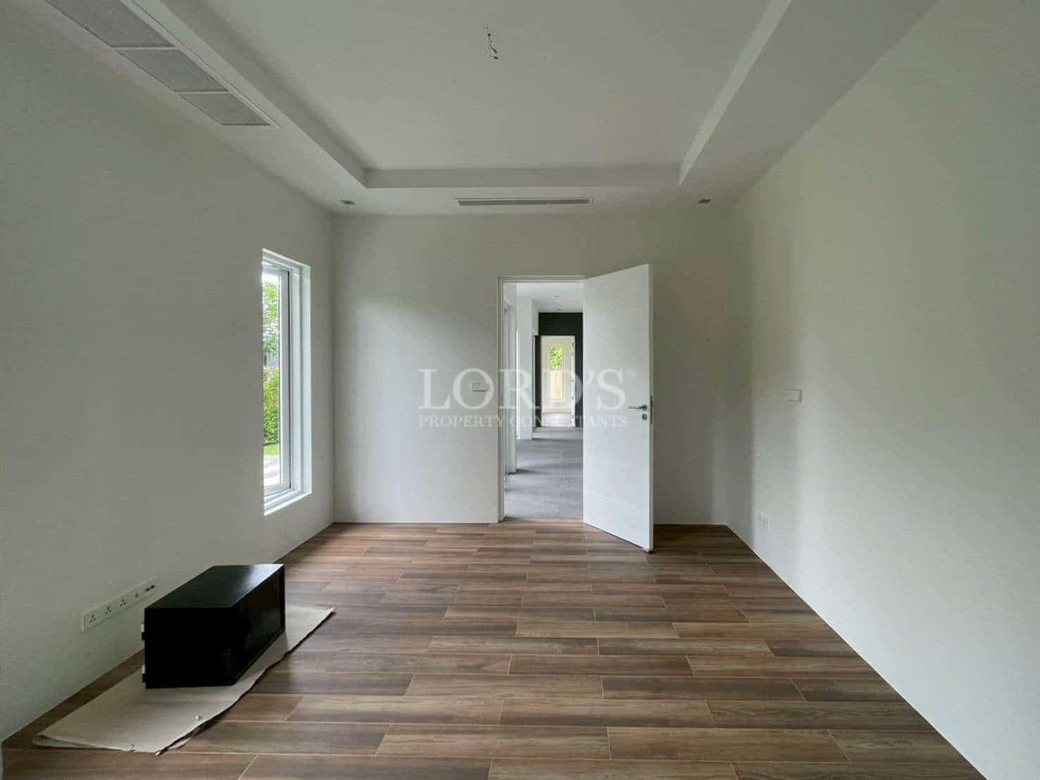 Empty room with wooden flooring