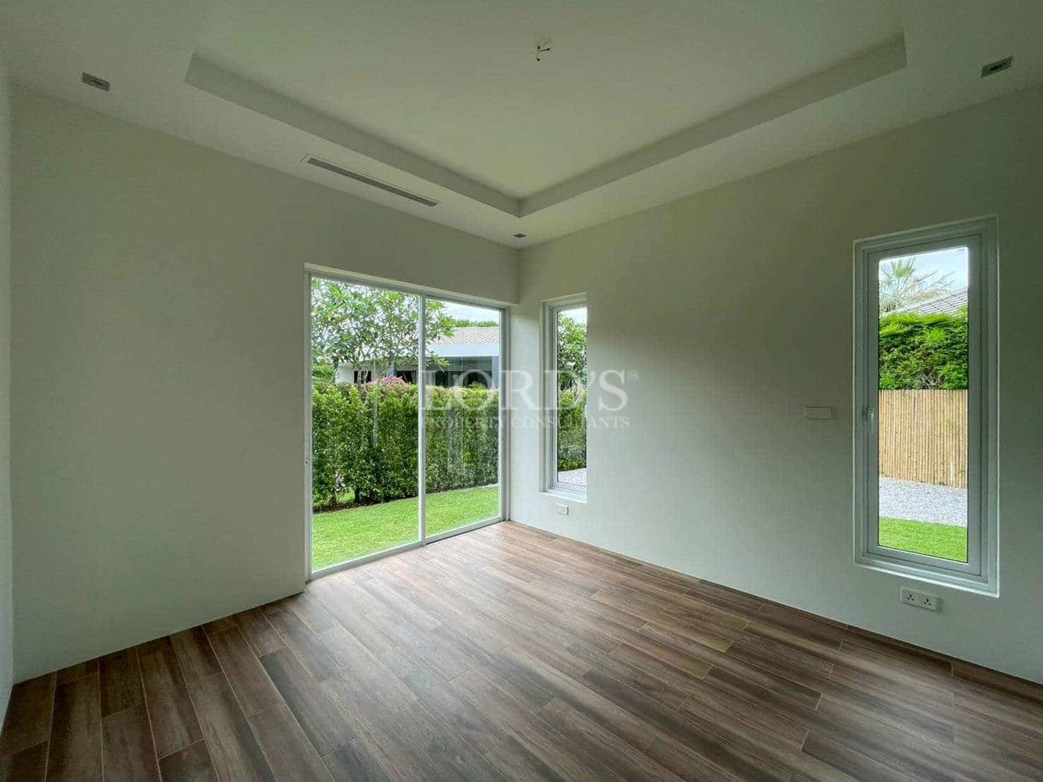 Empty room with large windows