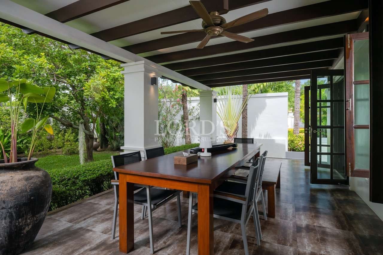 Outdoor dining area surrounded by greenery