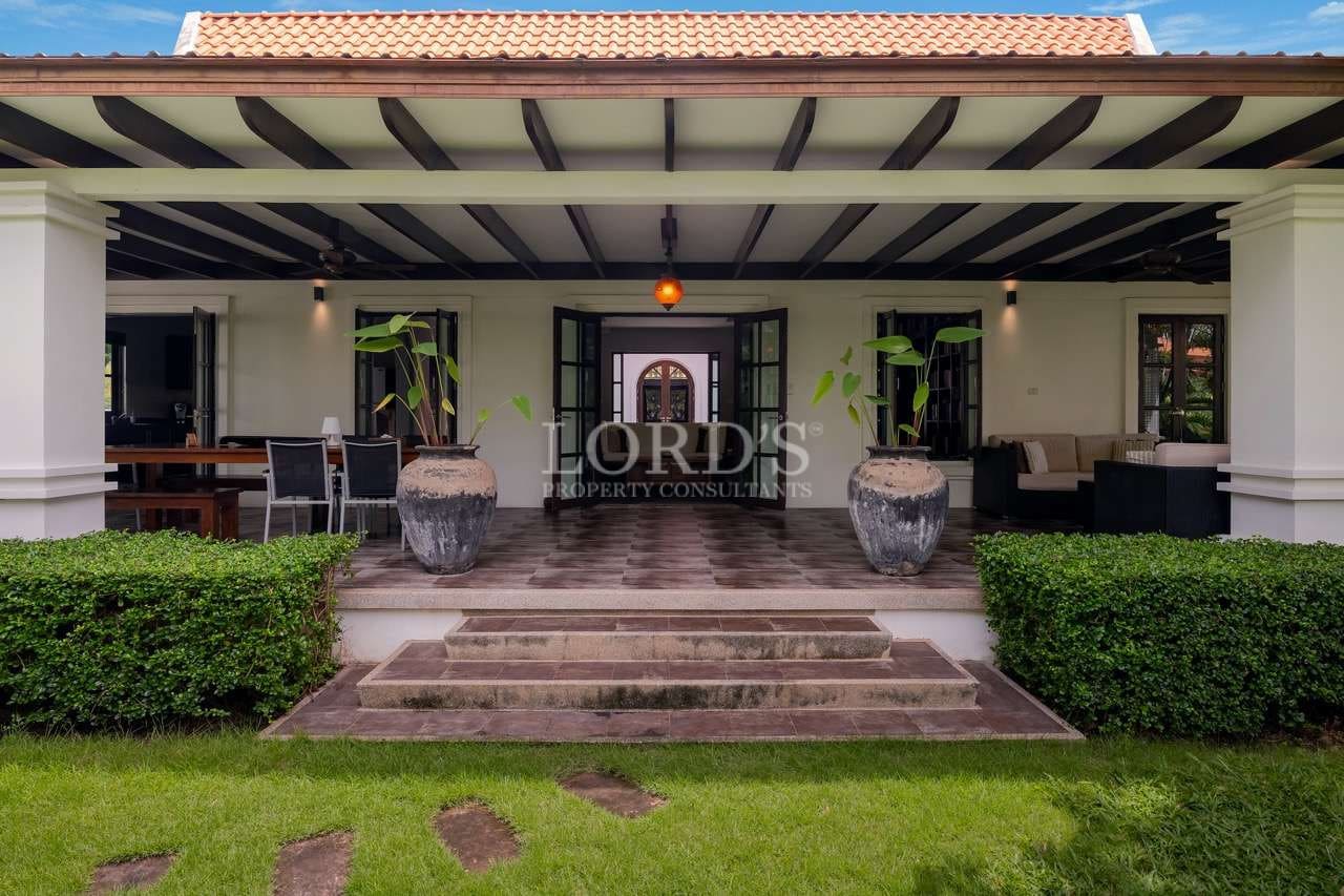 Elegant patio with lush greenery.