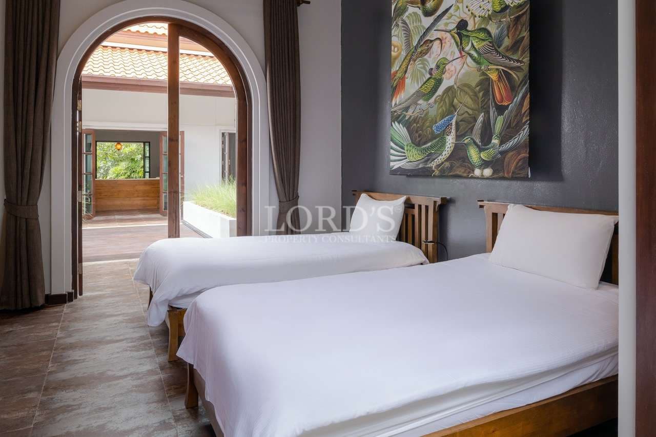 Bright room with two beds.